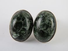 A pair of silver and green agate stud earrings, stamped 925, with butterfly backs,