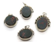 Four swivel fob pendants each set with bloodstone and carnelian,