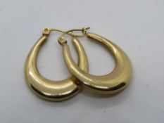 A pair of yellow metal hoop earrings, no apparent hallmarks, 1.7g.