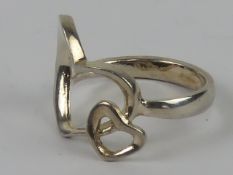 A silver ring in the form of two hearts, stamped 925, size M.