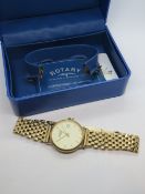 A 9ct gold mens Rotary wristwatch on 9ct gold strap, cream dial with date aperture, 33mm dia,