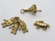 Three 9ct gold charms, a 375 hallmarked ballerina, a 375 hallmarked trio charm,