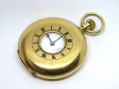 An 18ct gold half hunter keyless pocket watch, enamelled Roman numerals around the central window,