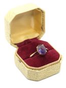 A vintage amethyst ring, the oval cut stone claw set in band stamped 9ct, size Q-R, 2.8g.