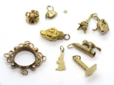 A quantity of yellow metal charms including a rabbit charm stamped 9ct, total weight 16.5g.