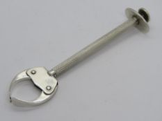 A pair of continental silver push release sugar tongs, marked 835.