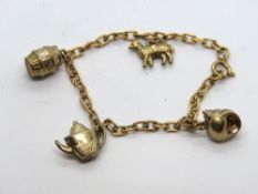 A rose metal charm bracelet having four 9ct golf charms upon, each charm hallmarked 375,