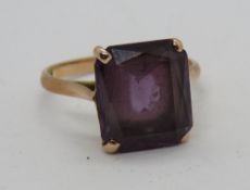 A purple topaz cocktail ring, octagonal cut stone, having Arabic hallmarks, size T, 5g.