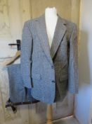 A mens wool suit jacket and trousers by Henry's Menswaer, 42R.