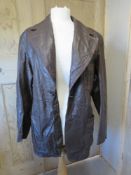 A brown leather jacket size 40.