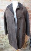 A vintage brown sheepskin coat, no apparent labels. In need of a dry clean.