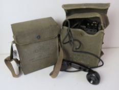 Two WWII US Military EE-8 field telephones in canvas pouches.