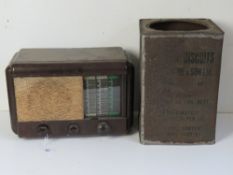 A WWII US biscuit tin with stencilling on the side and dated 1944.