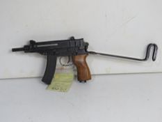 A deactivated Czech Skorpion Wz61 7.65mm Sub Machine Gun with slotted wooden grip.
