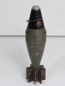 An inert WWII US 60mm M49A2 mortar round, dated 1943.