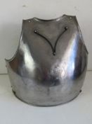 A front armour plate with straps, for decorative purposes.