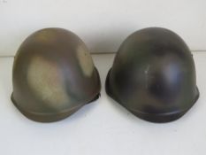 Two Russian helmets, both with German Liners, one liner is named.