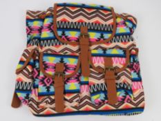 An Aztec pattern multi coloured ruck sac