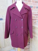 A ladies 70% wool, 10% cashmere coat in burgundy size 14 by Debenhams.