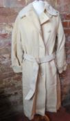 A ladies cream coloured 100% wool belted