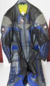 An Akita Maxx motorbike leather suit with knee, elbow and shoulder guards, size 42 UK.
