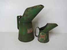 Two Castrol oil cans being pint and half pint.