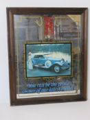 A vintage Rolls Royce themed mirror.