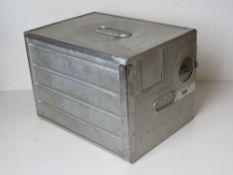 An Air Canada lockable aluminium storage canister opening to reveal two drawers within,