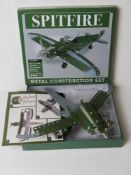 A part-built Meccano type metal construction set of a Spitfire, in unchecked condition.