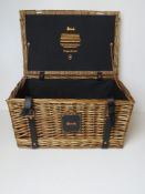 A Harrods wicker picnic hamper having bl