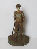 A painted cast iron doorstop in the form