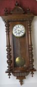 A mahogany wall clock having brass and w