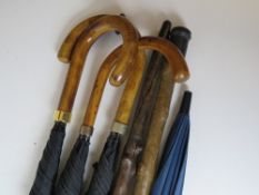 A quantity of vintage umbrellas and walk