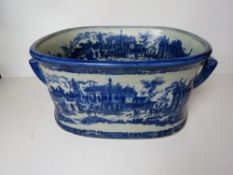 A large blue and white planter, blue gla