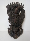 An Indo-Asian carved hardwood deity figu