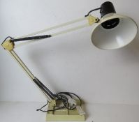 A vintage white angle poise type lamp ha