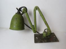 A green metal angle poise type workshop