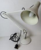A white metal angle poise type desk lamp