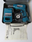 A Makita cordless drill in metal case, w