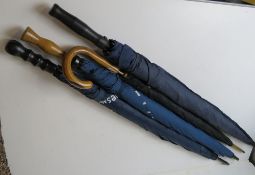 A vintage Fulton umbrella together with three contemporary umbrellas.