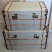 A fine pair of contemporary green canvas covered graduated trunks, largest 69 x 44 x 41cm,