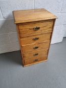 A bedside chest of five drawers, each drawer having brass drop handle measuring approx. 46 x 36.