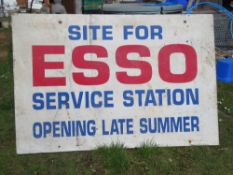 A large painted board 'Site for Esso Service Station Opening Late Summer' measuring approx 122 x