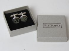 A pair of as new cufflinks in the form of dashboard dials by Onyx-Art in presentation box.