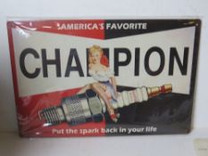 A contemporary metal garage Champion spark plugs advertising sign, 30 x 20cm.