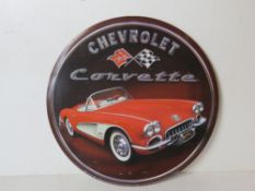 A contemporary metal Chevrolet Corvette sign measuring approx 30.5cm dia.