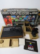 An Atari video computer system in packaging.