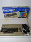 A Commodore 64 microcomputer in original packaging.