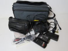 A Canon 8mm UC200 Camcorder with accessories in case.
