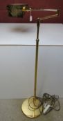 A mid century Italian made brass cantilever adjustable height floor lamp.